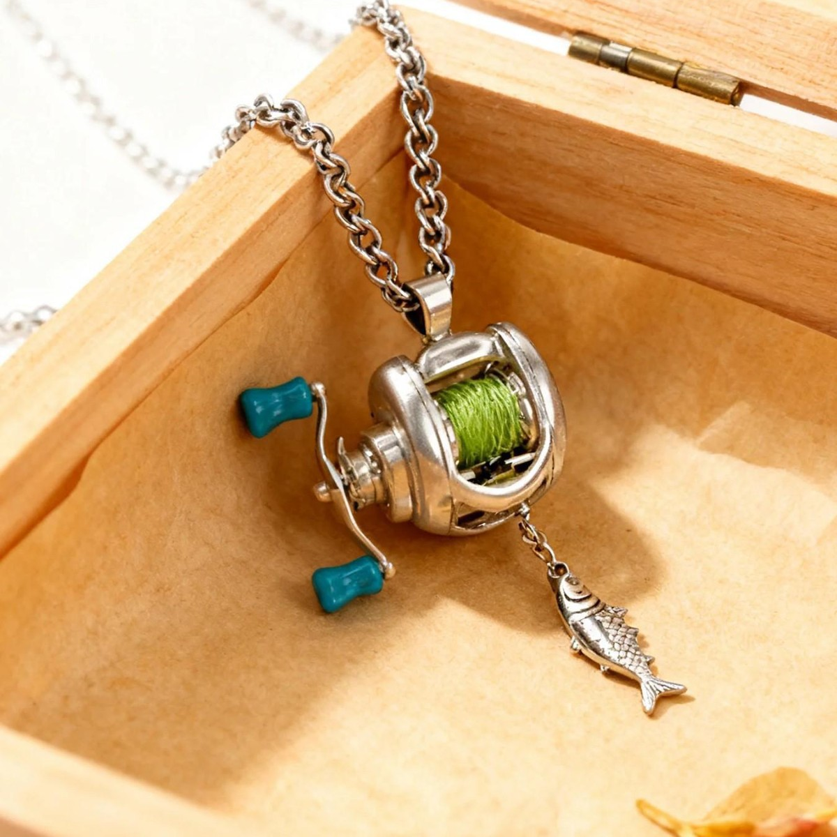 Mini fishing reel necklace